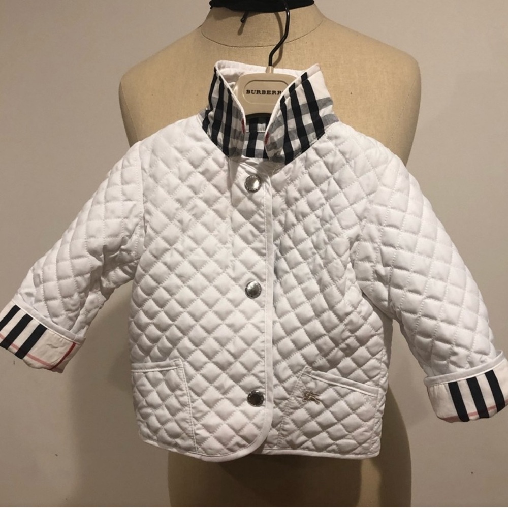 Gently used white 12 month Burberry quilted jacket.